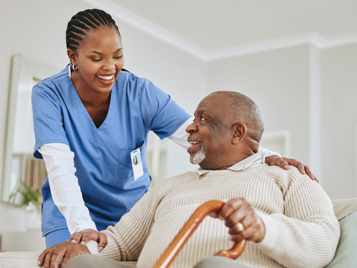 A caregiver providing warm companionship to an older adult at home